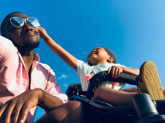 Haitian toddler pinches father's cheek
